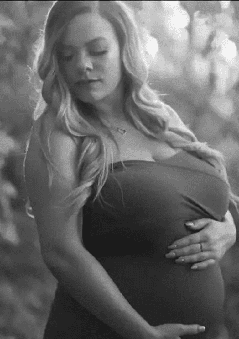 Pregnant woman in nature, black and white.