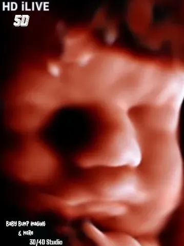 A blurry picture of a face with red light.
